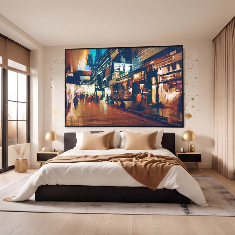 Tablou canvas cu pictura urbana cu strada luminata noaptea, in rama de aluminiu negru, pe perete intr-un dormitor